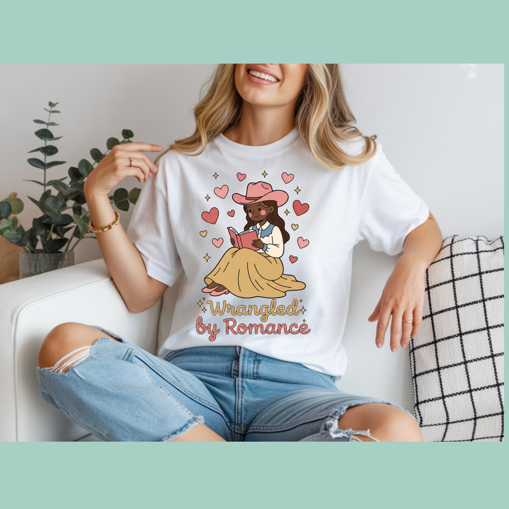 Person wearing a white t-shirt with a graphic design and text, sitting on a couch.